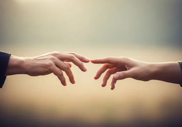 Hands reaching out to connect, symbolizing crisis help